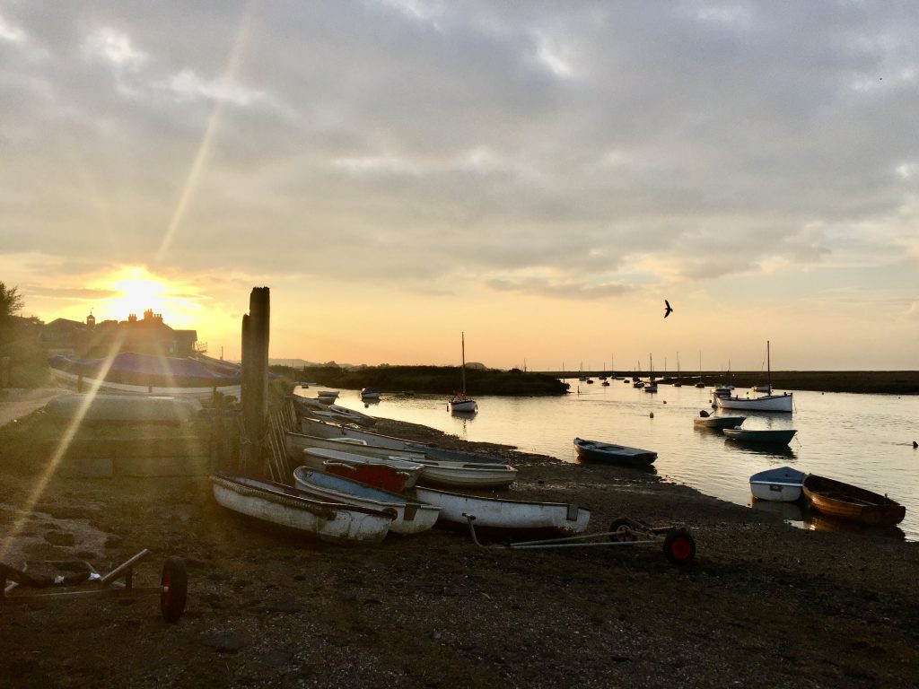 A boat parked next to a body of water

Description automatically generated